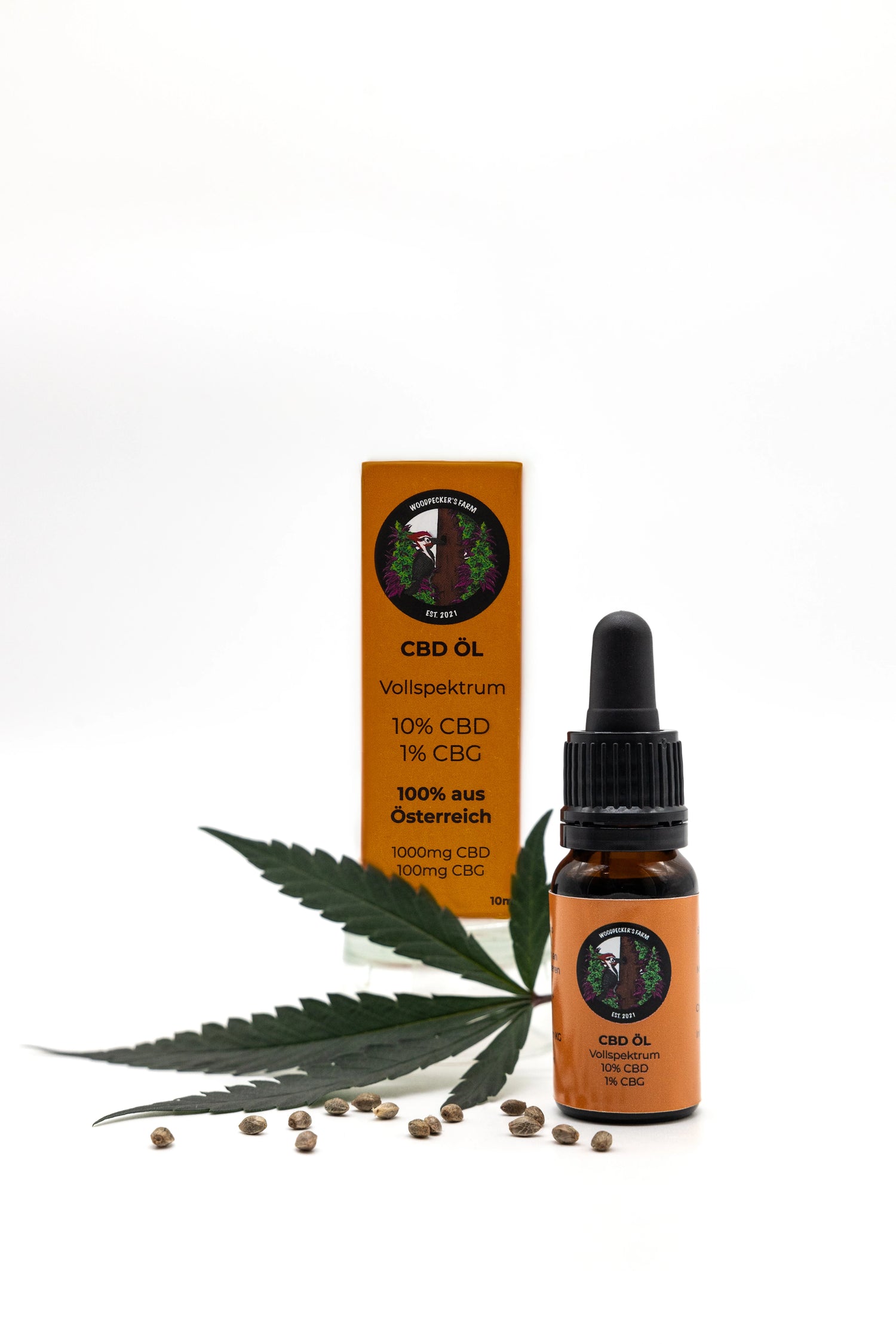 10% CBD Öl Vollspektrum mit Bio-Hanfsamenöl, braune Flasche mit Pipette vor orangefarbener Verpackung.